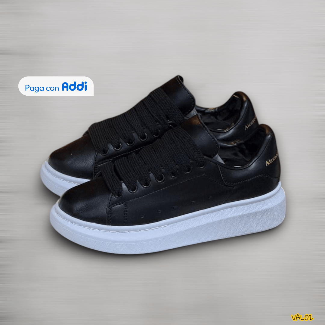 Tenis Alexander McQueen negro blanco look moderno premium