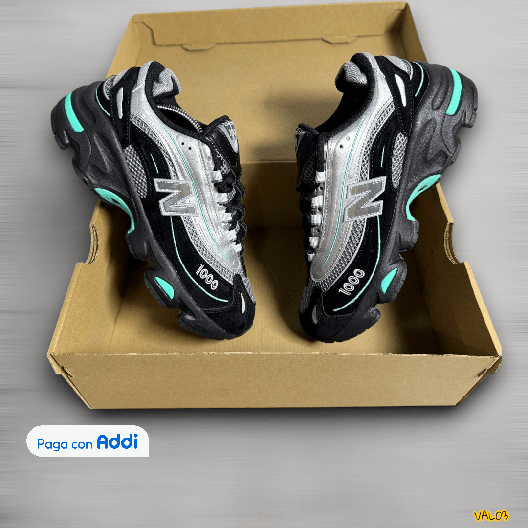 Tenis New Balance 1000 negro plateado azul estilo running urbano diseño deportivo moderno calidad 1.1