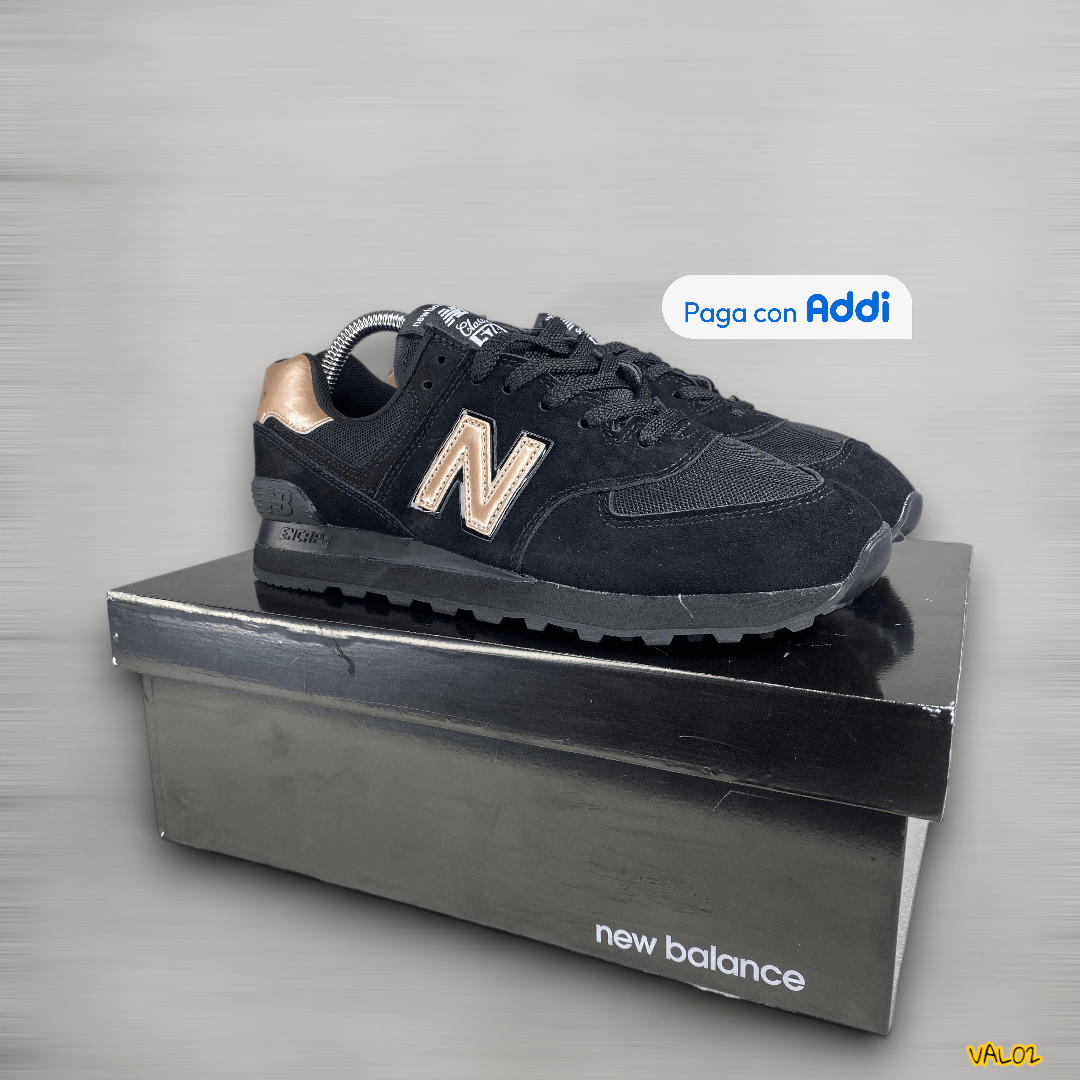 Tenis New Balance 574 negro dorado diseño elegante deportivo