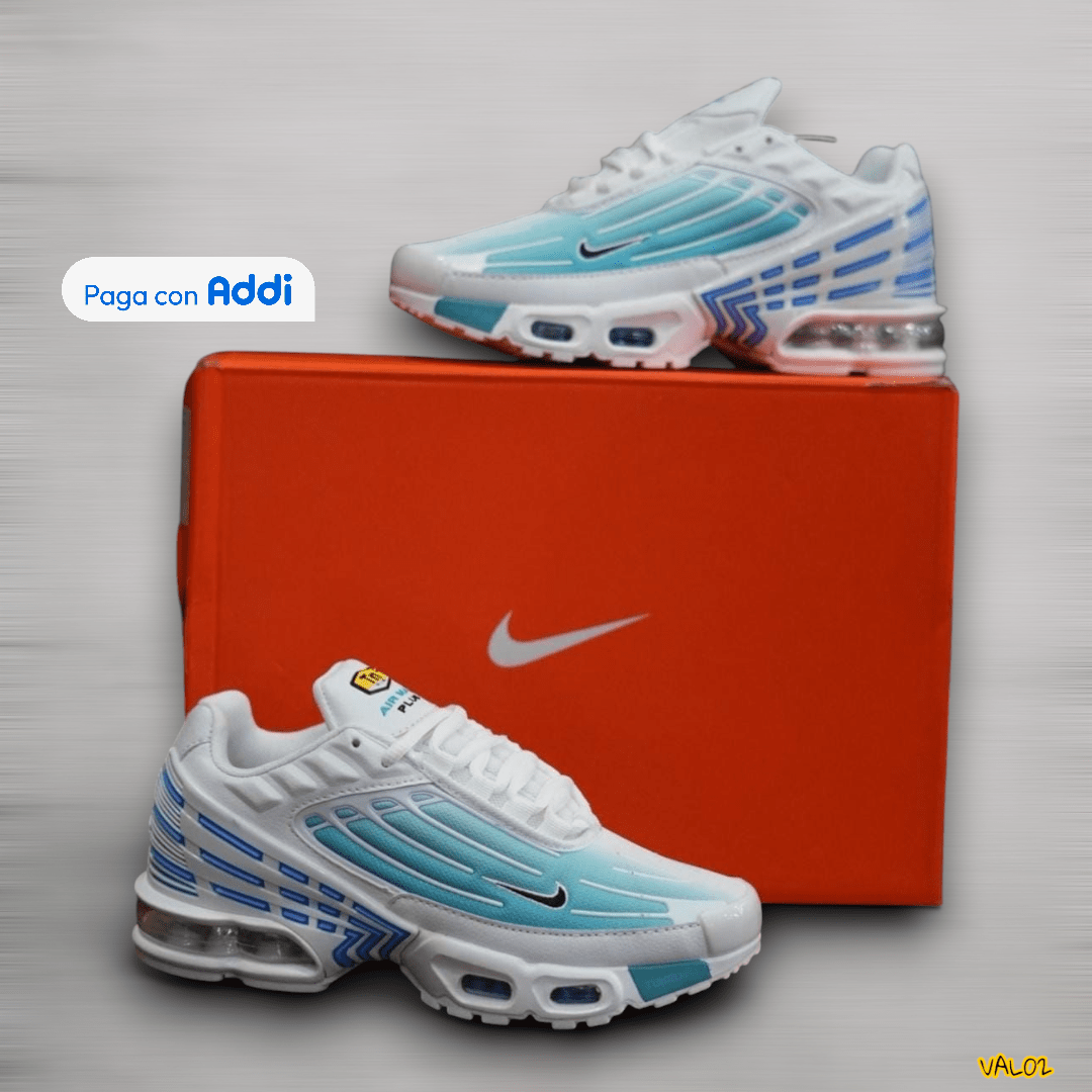 Tenis Nike TN Plus blanco azul diseño urbano con amortiguación