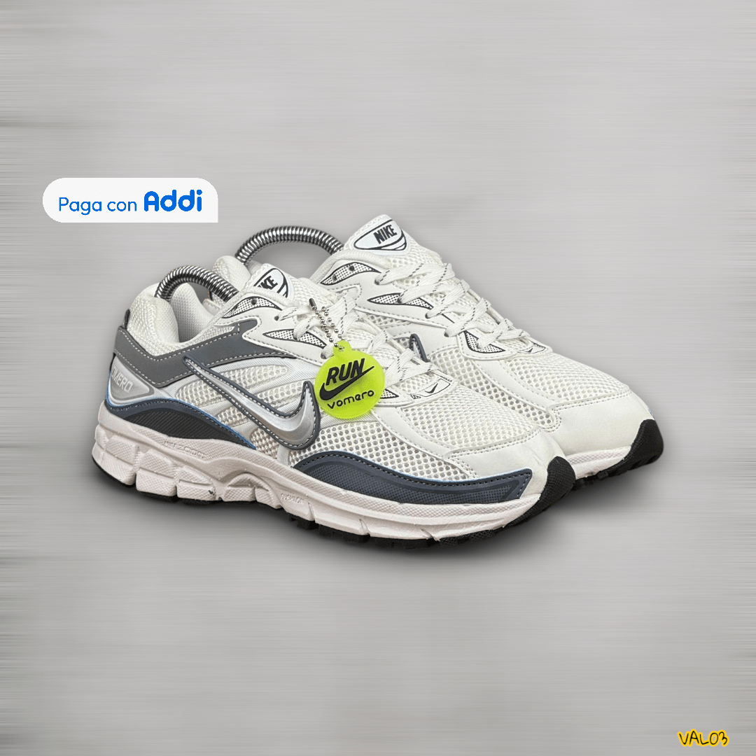 Tenis Nike Vomero blanco plateado gris estilo running deportivo unisex suela cómoda calidad 1.1