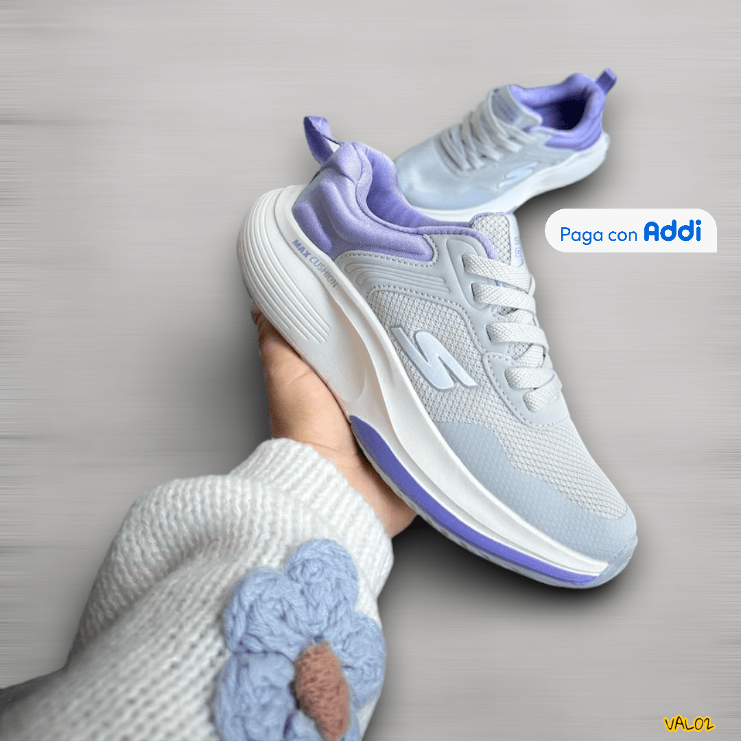 Tenis Skechers Max Cushion gris morado acabado deportivo premium