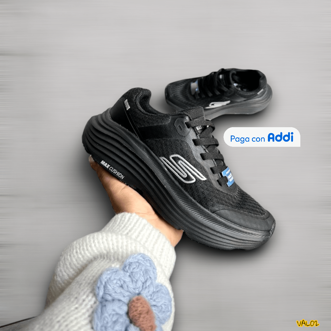 Tenis Skechers Max Cushion negro plateado acabado deportivo premium
