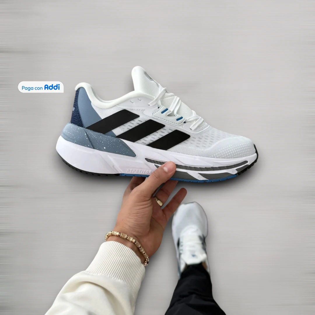 Tenis Adidas Adistar unisex blanco azul negro para running y entrenamiento, con amortiguación, soporte y diseño deportivo dinámico