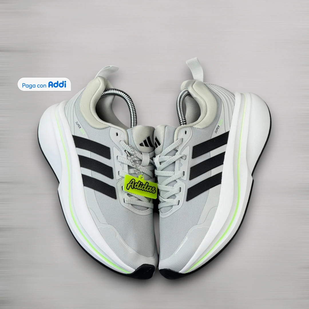 Tenis Adidas Supernova hombre gris negro para running y entrenamiento, con amortiguación, soporte y comodidad en cada zancada