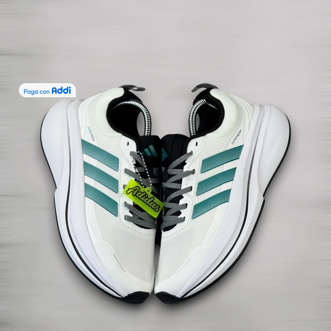 Tenis Adidas Supernova hombre blanco verde estilo running deportivo, ideales para correr y caminar con pisada estable y ligera
