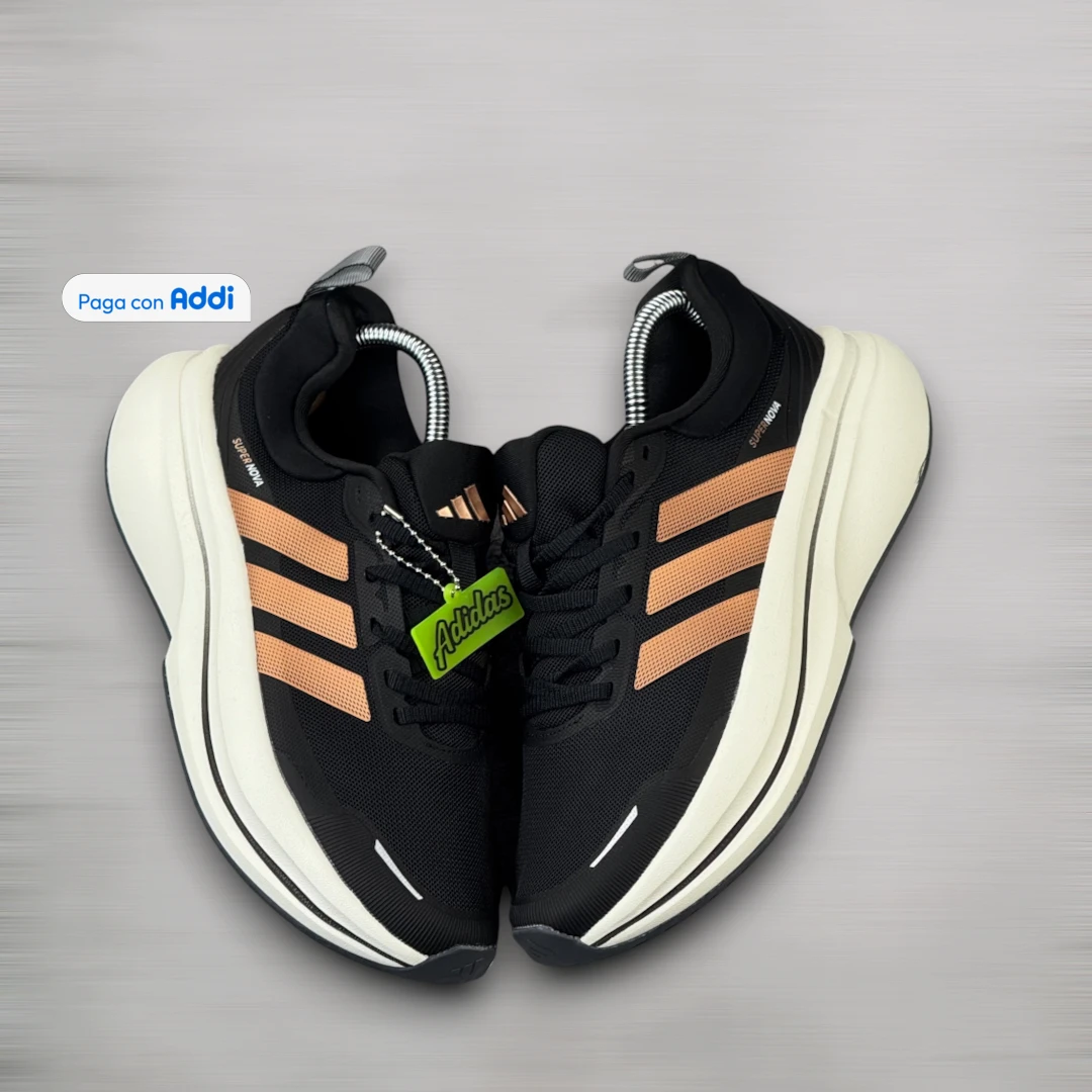 Tenis Adidas Supernova hombre negro naranja para correr y entrenar, con diseño atlético, amortiguación y confort prolongado