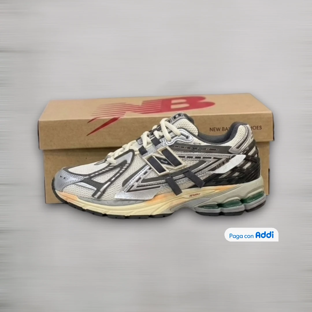 Tenis New Balance 1906 plateado negro para uso diario con diseño running y máxima comodidad