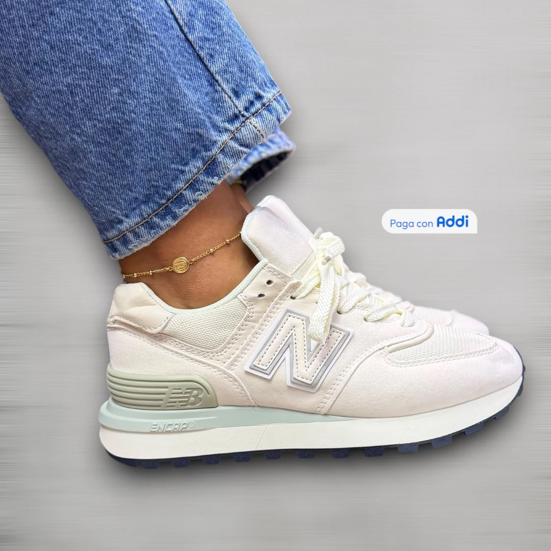 Tenis New Balance 574 mujer gris blanco para uso diario con estética retro, soporte ligero y suela flexible