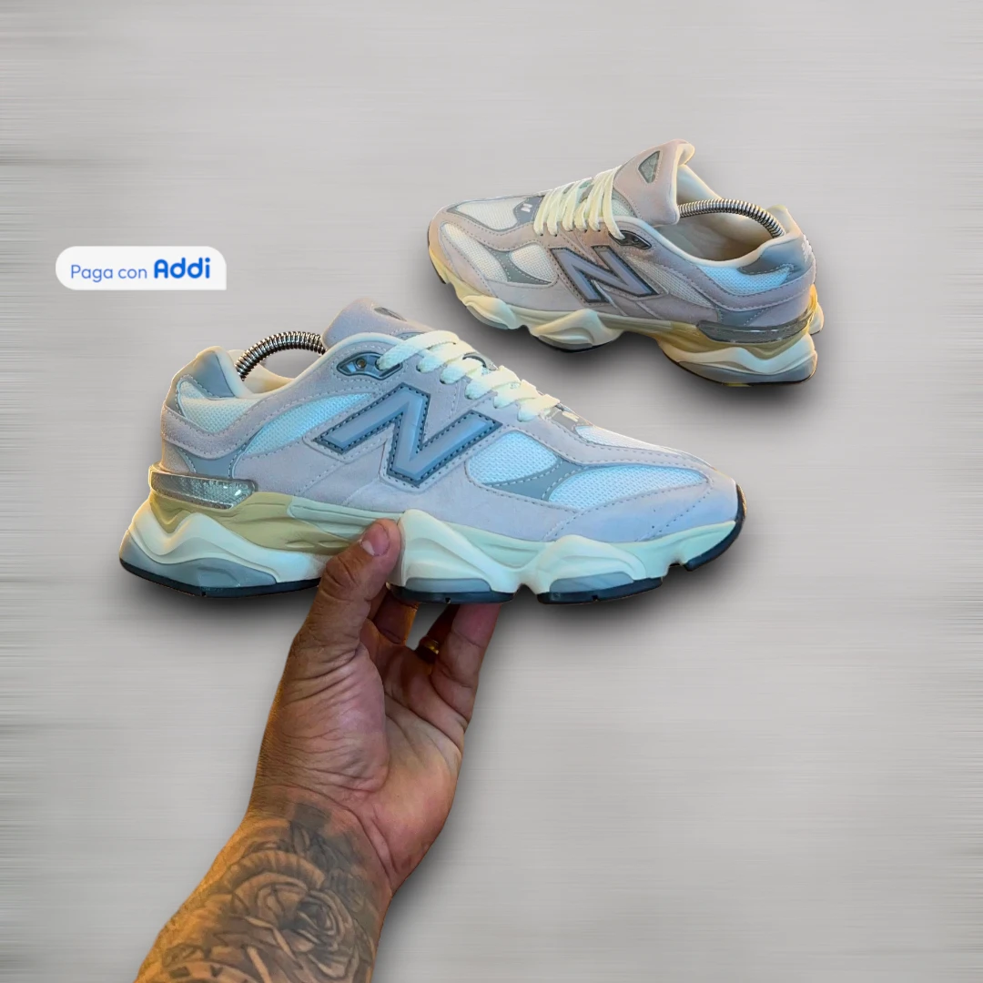 Tenis New Balance 9060 gris blanco azul estilo casual urbano para caminar con diseño moderno y comodidad premium