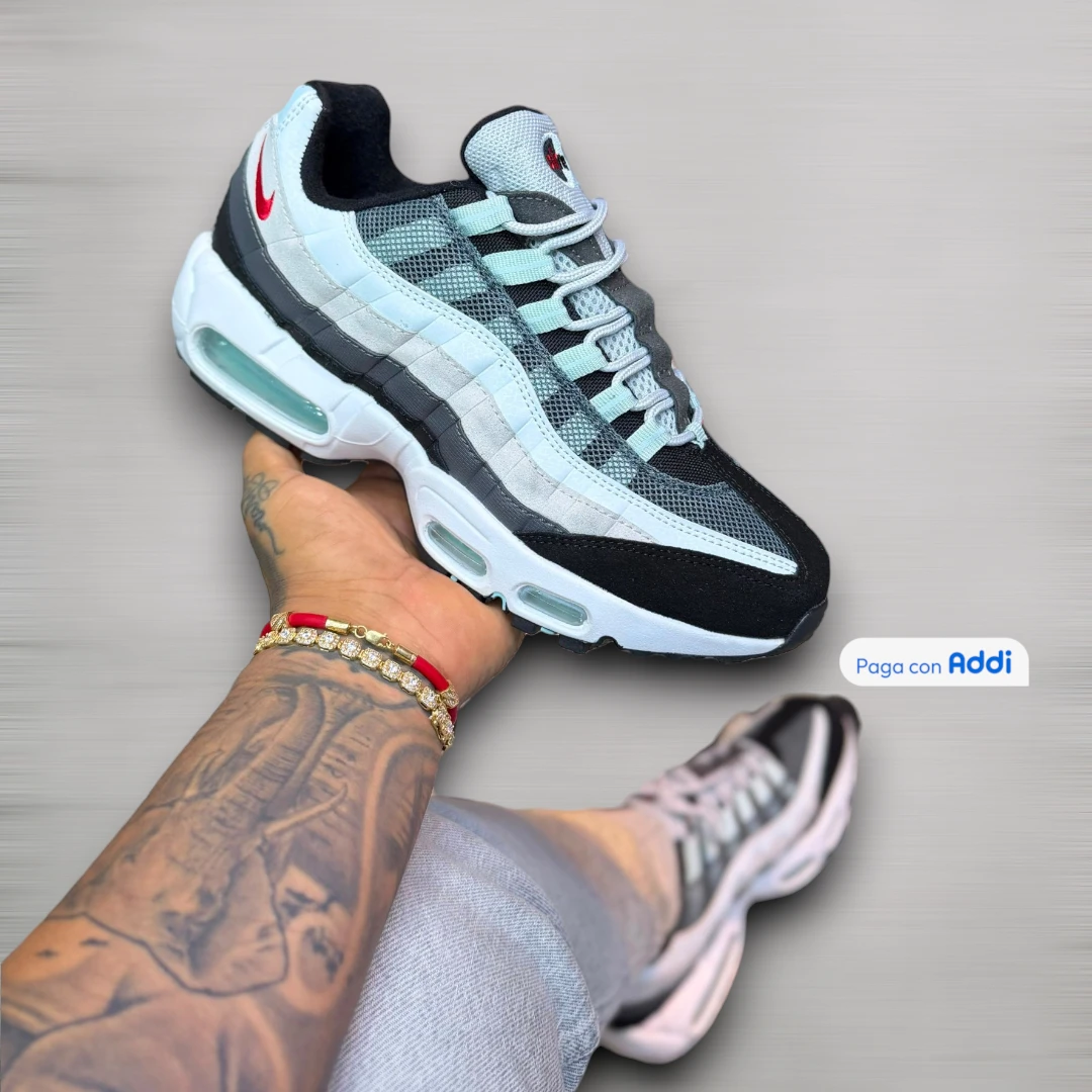 Tenis Nike 7 Cámaras hombre blanco gris rojo de estilo urbano atlético, suela robusta y sensación estable al caminar
