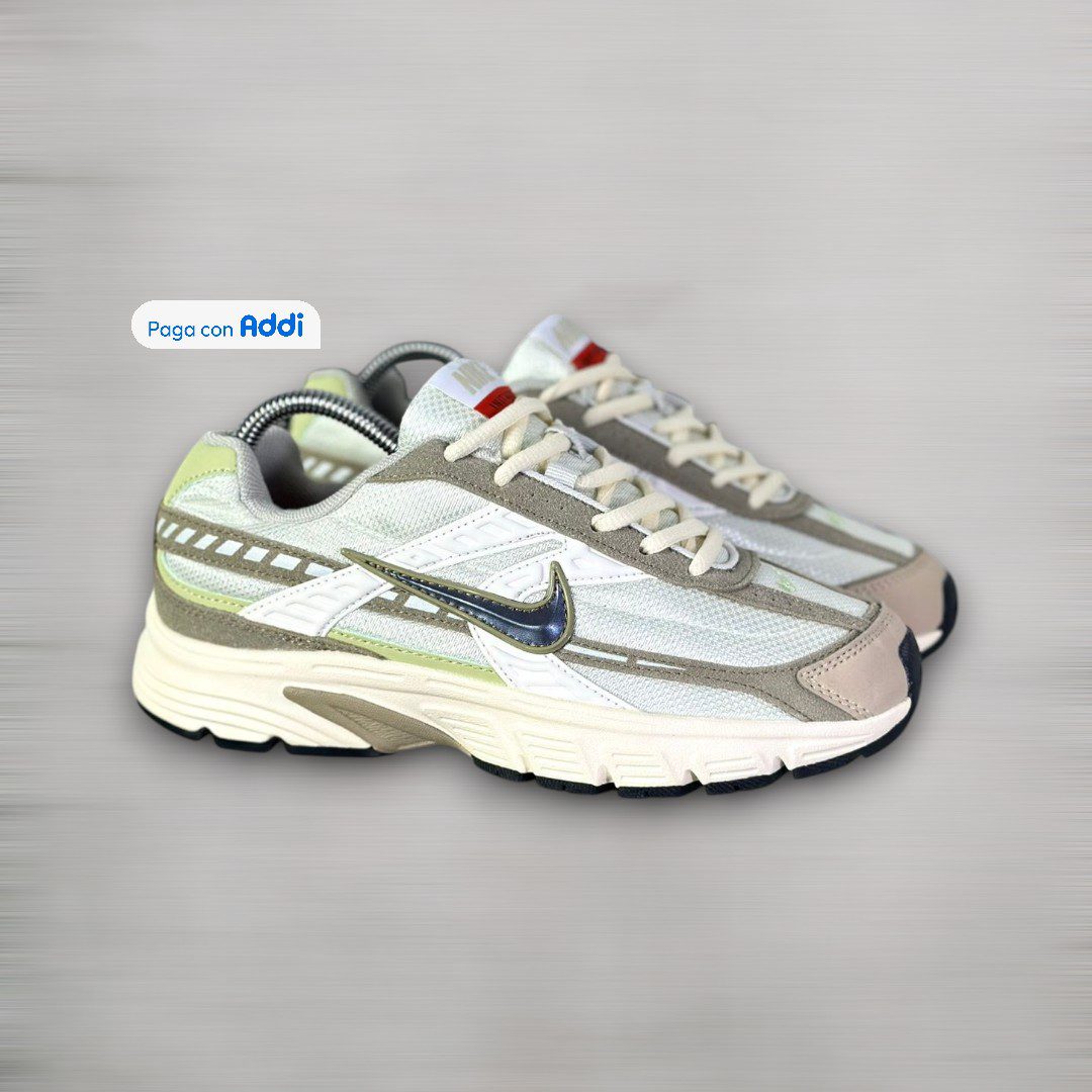 Tenis Nike Initiator blanco negro café para uso diario con estilo running urbano y máxima comodidad