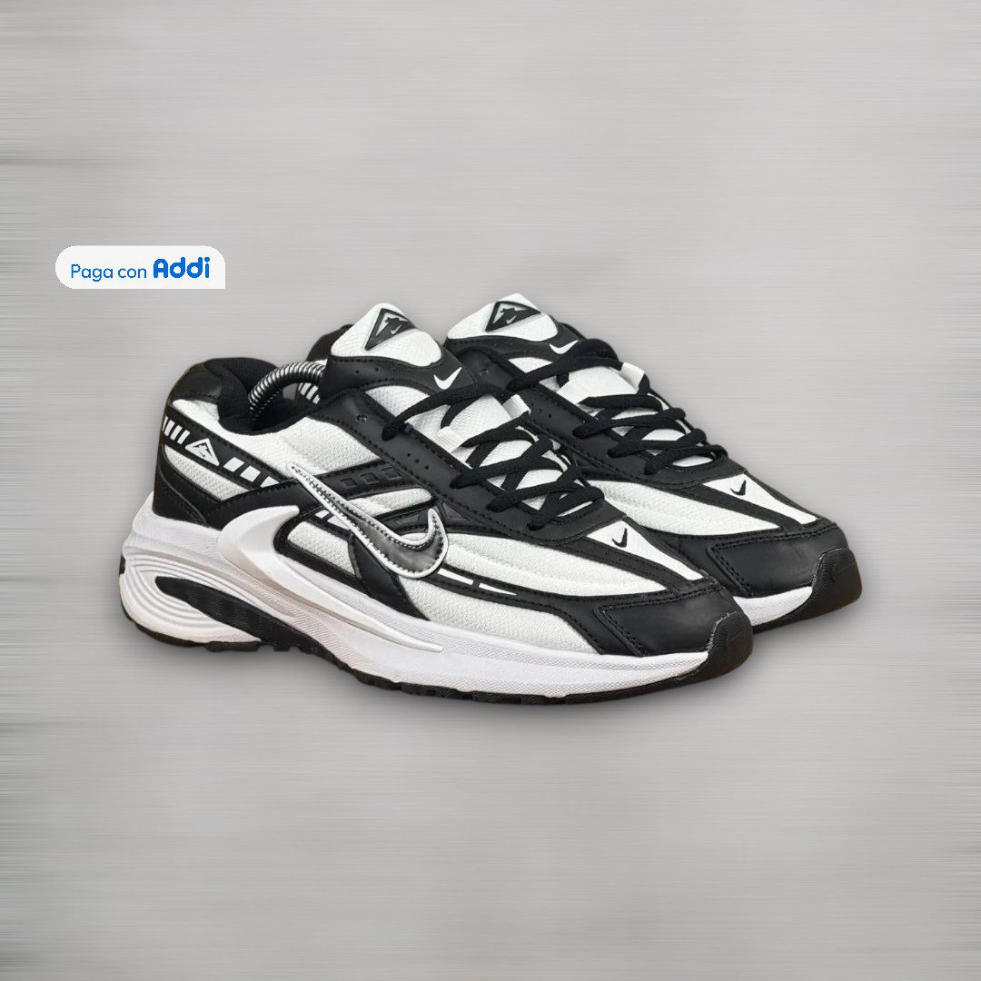Tenis Nike Initiator negro blanco para caminar con amortiguación ligera y estilo deportivo urbano