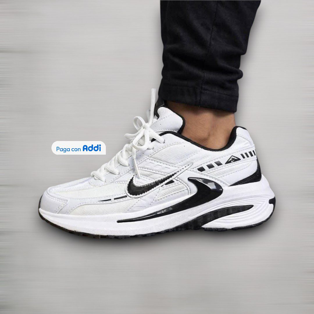 Tenis Nike Initiator blanco negro estilo deportivo para caminar con suela cómoda y diseño running clásico
