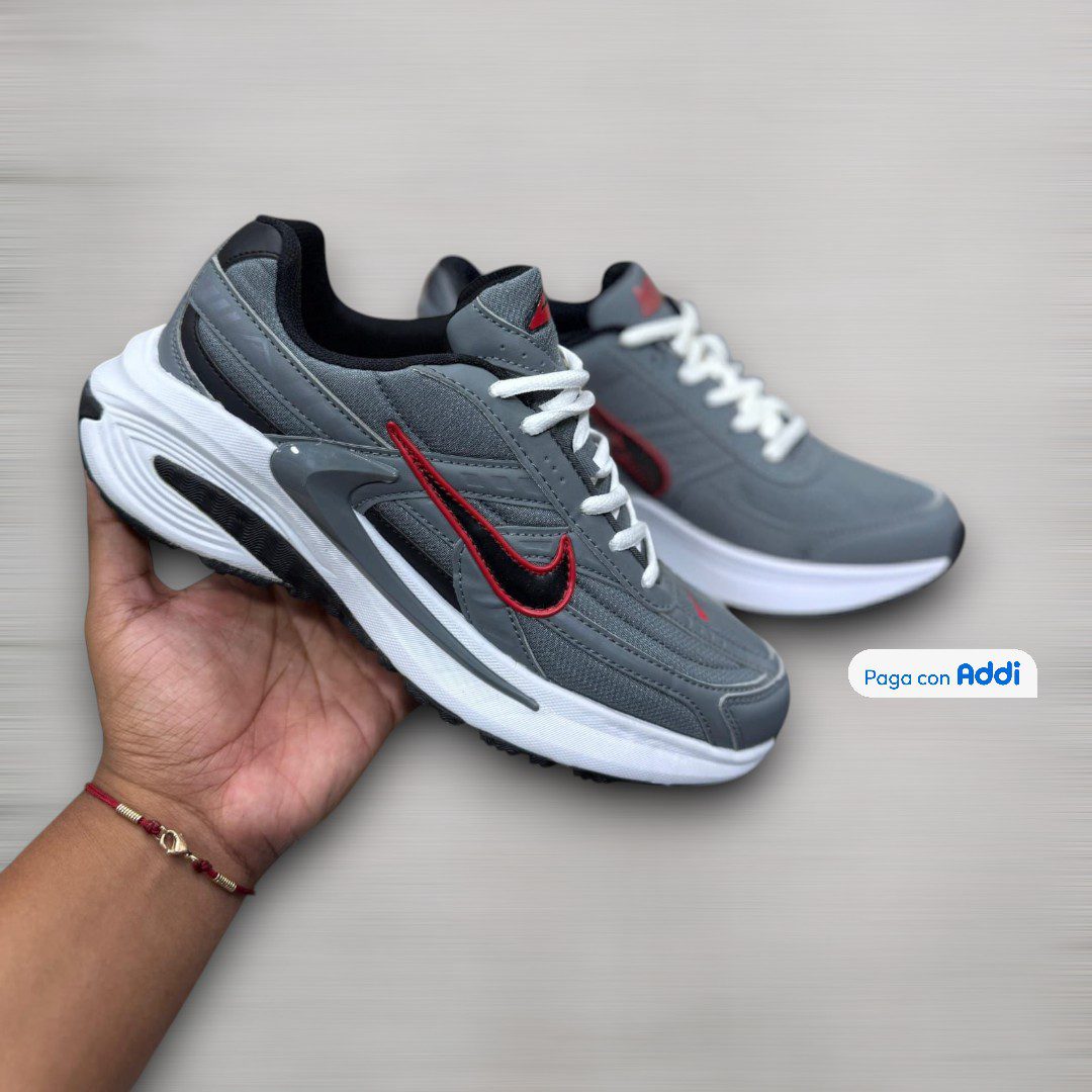 Tenis Nike Initiator gris rojo para uso deportivo con amortiguación cómoda y estilo running actual