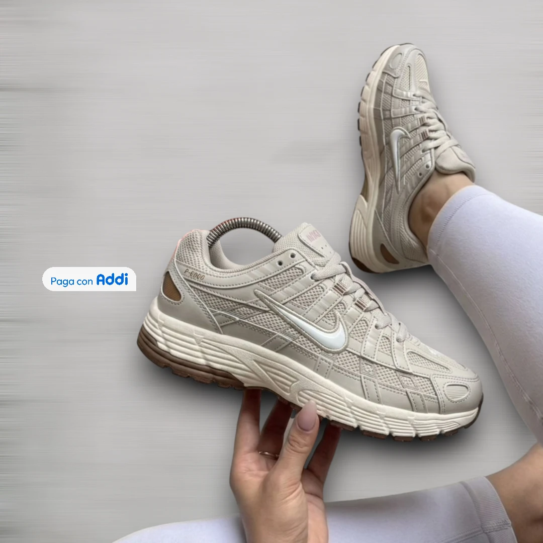 Tenis running Nike P6000 blanco plateado y negro para mujer con diseño deportivo moderno