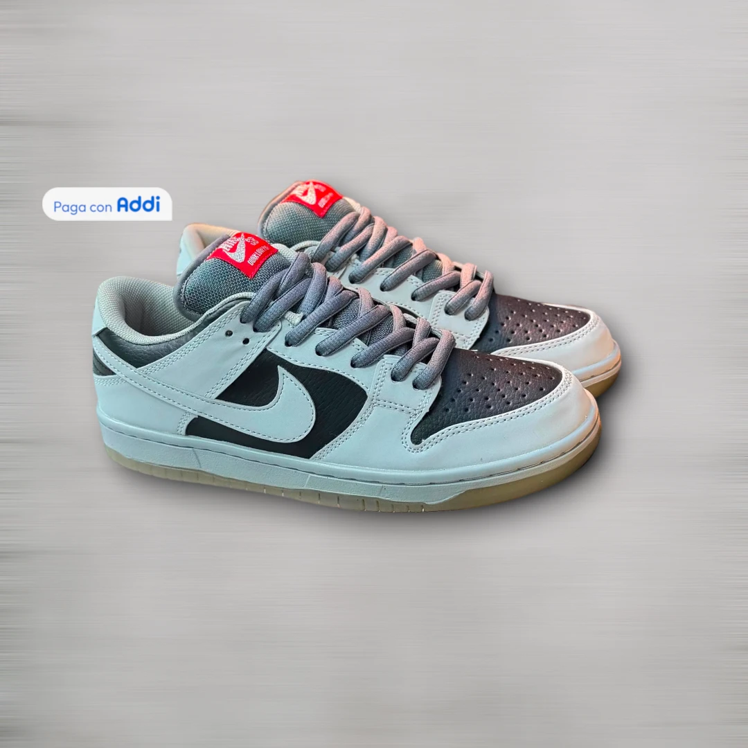 Tenis Nike SB hombre gris negro para skate y uso urbano, con construcción firme, tracción y comodidad durante el día