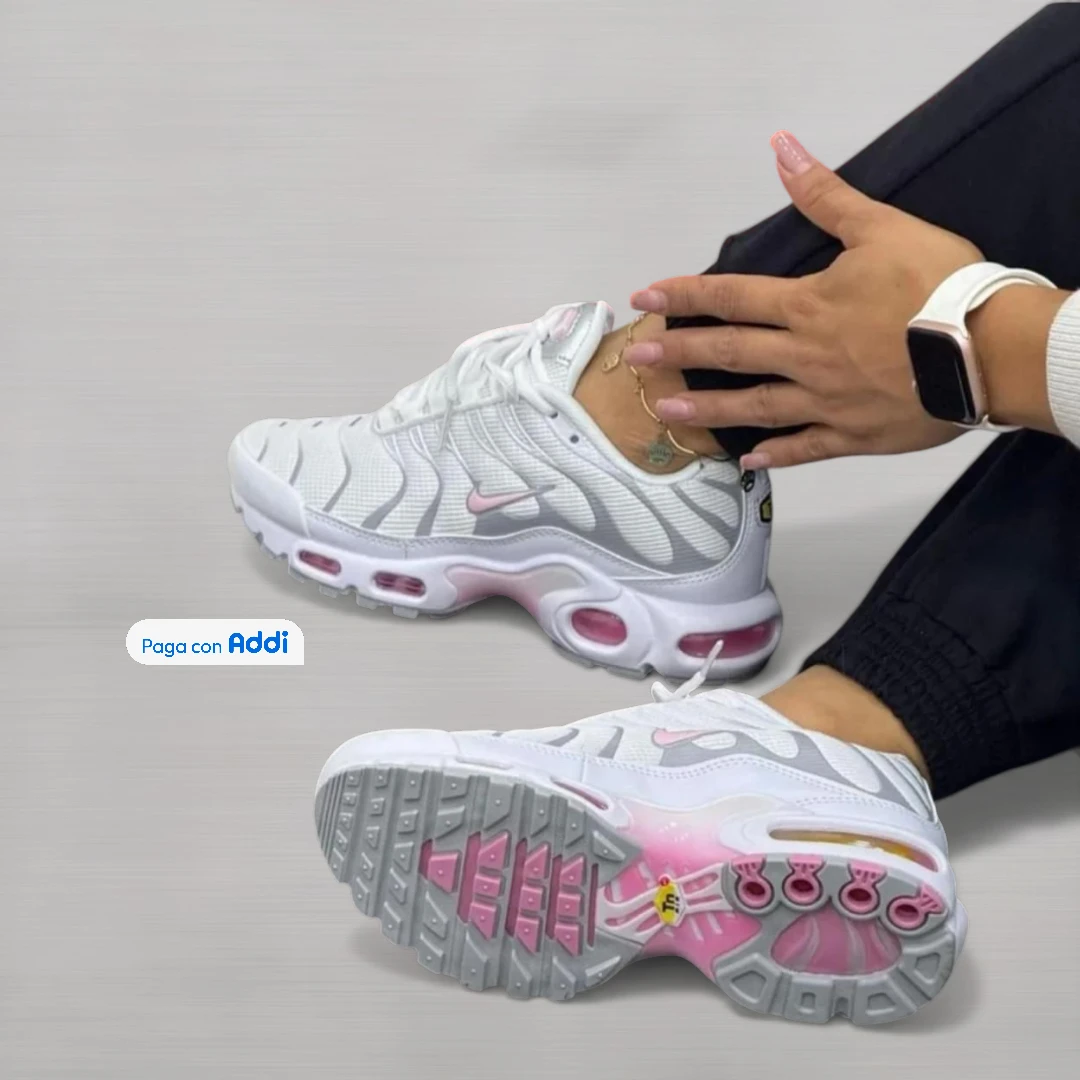 Tenis femeninos blancos con detalles rosados, diseño deportivo moderno y suela marcada