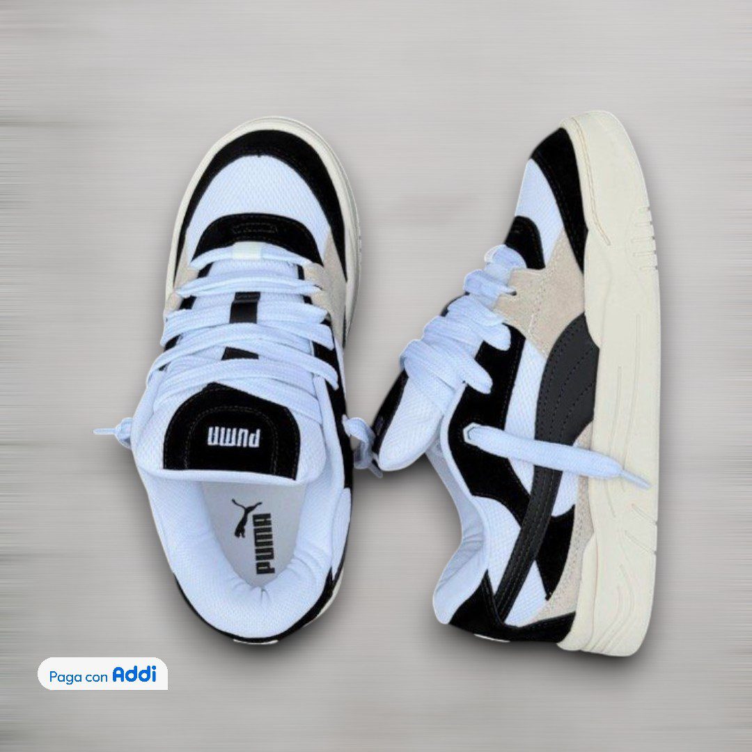 Tenis Puma 180 calidad 1.1 blanco con negro inspirados en la tendencia skate y streetwear actual. Diseño robusto, acabados premium y comodidad ideal para uso diario con estilo urbano moderno.