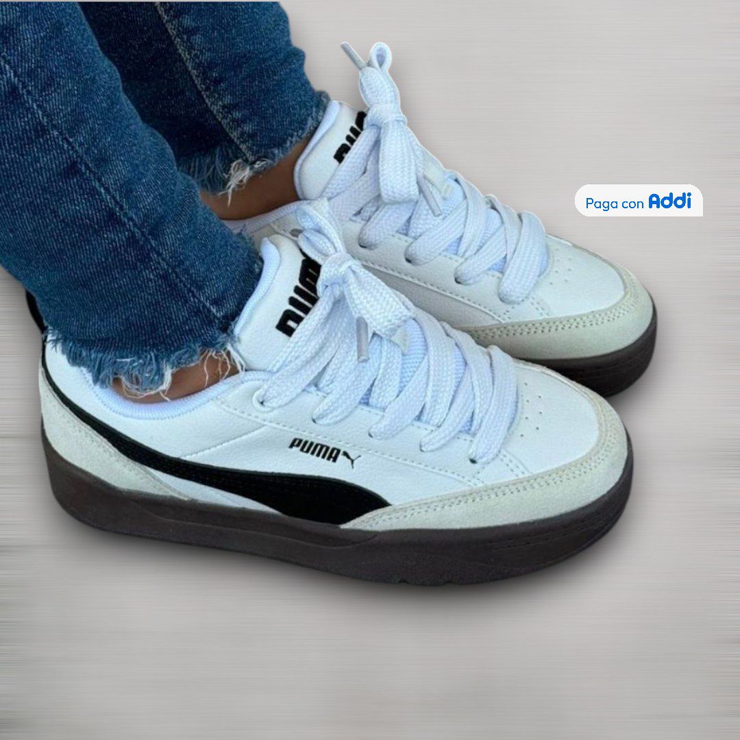 Tenis Puma Park calidad 1.1 blanco con negro de estilo urbano y diseño minimalista en tendencia. Acabados premium, excelente comodidad y versatilidad para combinar con outfits casuales y deportivos.