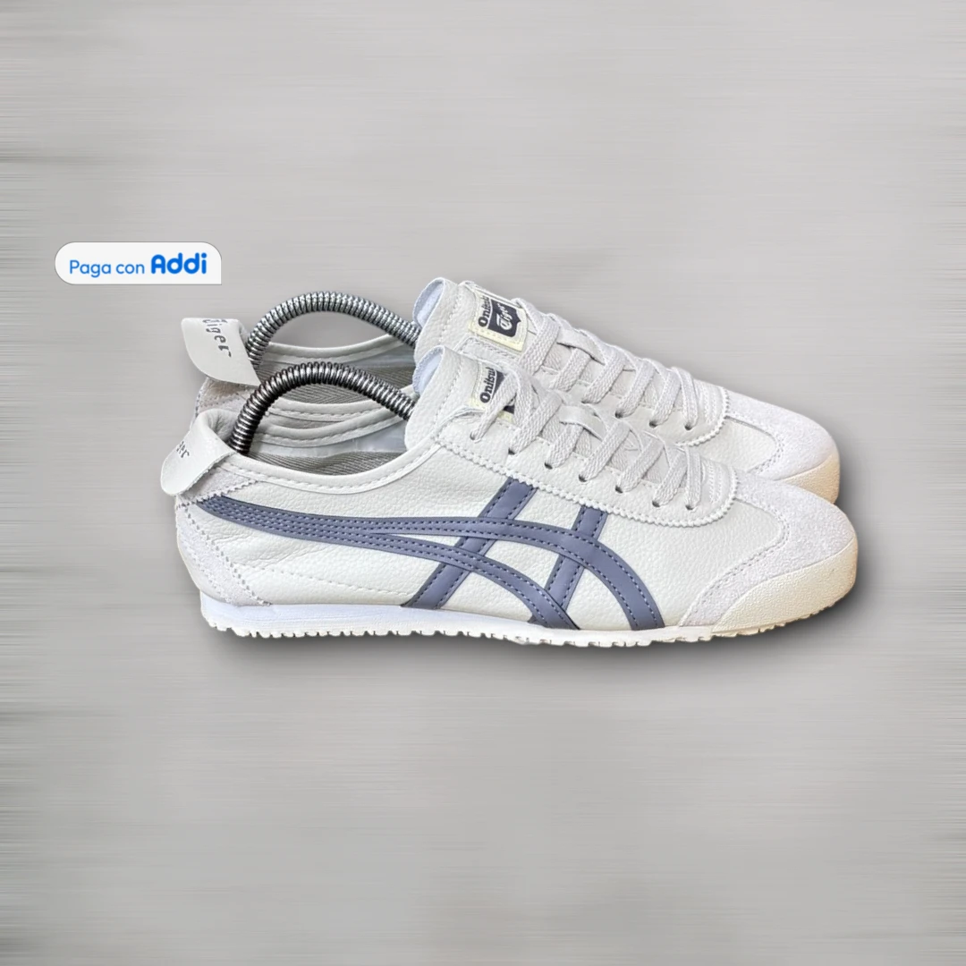 Tenis Tiger Onitsuka hombre blanco morado de estética casual contemporánea, con perfil ligero, suela flexible y confort
