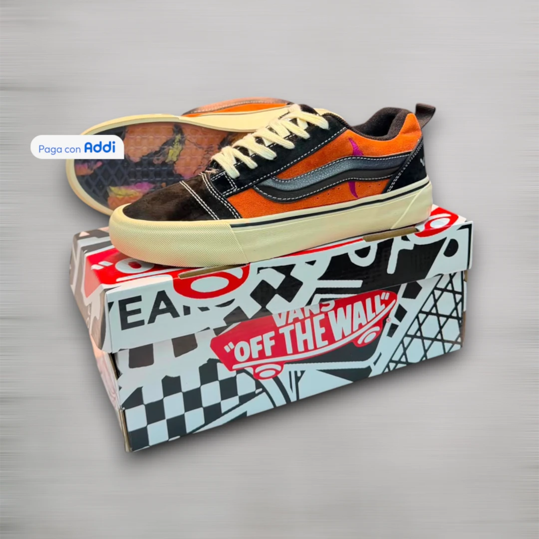 Tenis Vans hombre negro naranja estilo urbano con suela resistente y diseño moderno